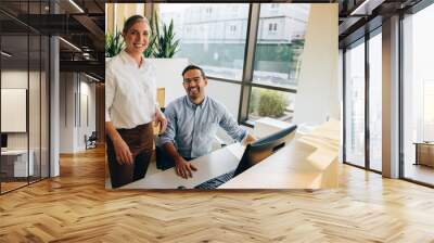 Business executives looking at camera Wall mural