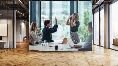 Business people celebrating success in conference room Wall mural