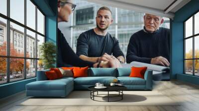 Business people discussing over a contract in meeting Wall mural