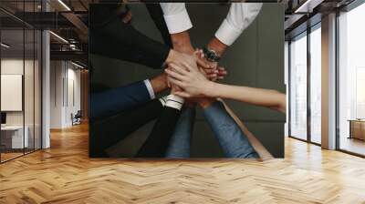 Business people showing unity Wall mural