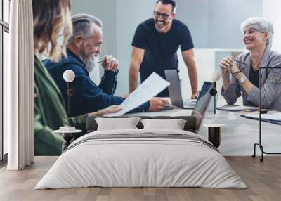 Business people smiling during a meeting Wall mural