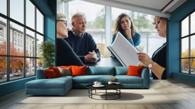 Business team discussing over an agreement in meeting Wall mural