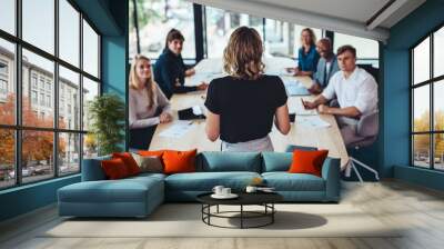 Business woman addressing a meeting in office Wall mural