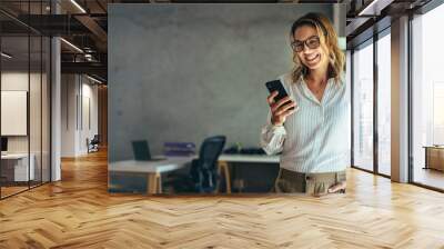 Business woman portrait in office Wall mural