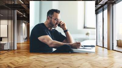 Businessman busy working in office Wall mural