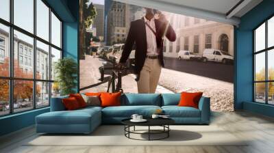 Businessman going to work by bicycle Wall mural