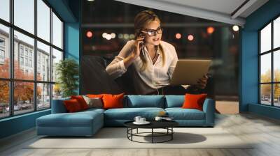 Businesswoman doing video call in office Wall mural