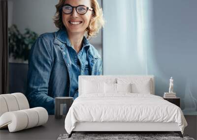 caucasian woman working at her desk in office Wall mural