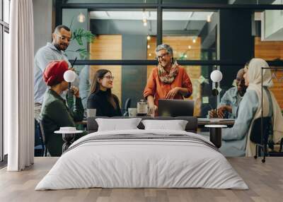 Cheerful businesspeople having a meeting in a boardroom Wall mural