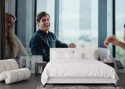 Cheerful businesspeople sitting in conference room Wall mural