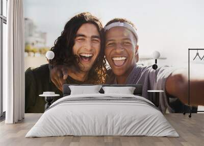 Cheerful friends making a selfie outdoors Wall mural