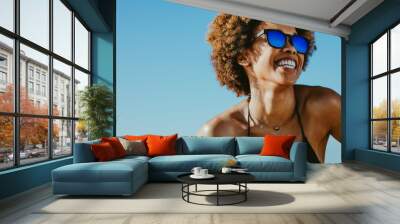 Cheerful woman on summer vacation Wall mural