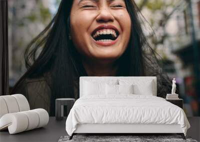 Close up of an asian woman laughing Wall mural