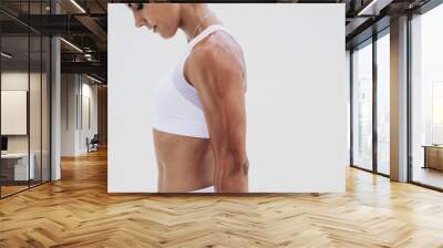 Close up of an athletic woman standing during workout Wall mural