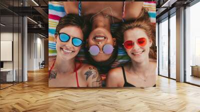 Close up of women relaxing on beach Wall mural