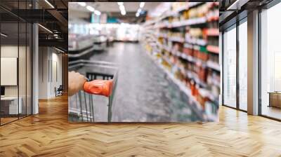 Closeup of customer with shopping cart Wall mural