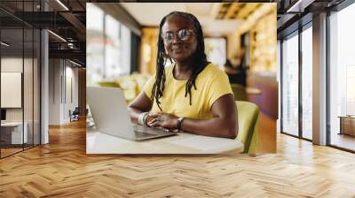 Confident business owner working her a cafe Wall mural