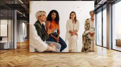 Confident businesswomen having a discussion during a conference meeting Wall mural