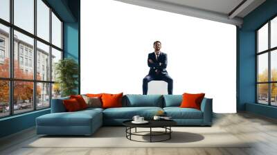 Confident young businessman sitting on top of a block on a transparent background Wall mural