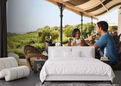 Couple enjoying a glass of wine in a winery restaurant Wall mural