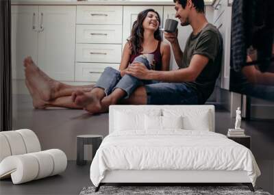 Couple having coffee in kitchen Wall mural