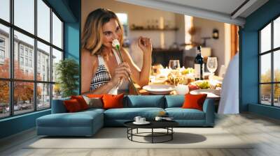 Couple having romantic dinner at home Wall mural