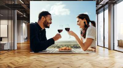 Couple on a date sitting in a restaurant Wall mural