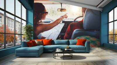 Couple on a road trip taking detour Wall mural