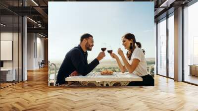 Couple on a romantic wine date Wall mural