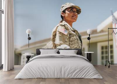 Courageous female soldier returning home from the army Wall mural