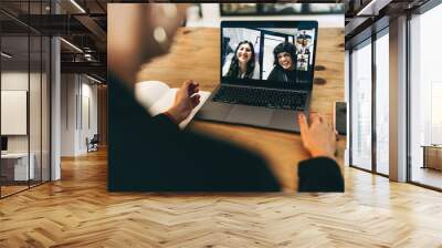 Creative businesswoman attending a video conference in an office Wall mural