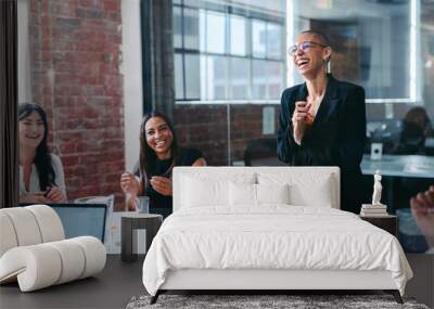 Creative businesswoman being applauded by her team Wall mural