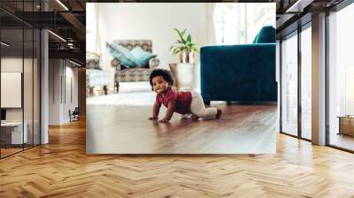 Cute baby crawling on floor Wall mural