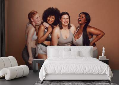 Different sized woman laughing together Wall mural