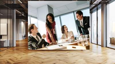 Diverse business people smiling during a meeting Wall mural