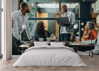 Diverse business team having a meeting in a creative workplace Wall mural