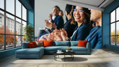 Diverse colleagues clapping and smiling during business meeting Wall mural