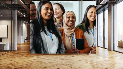 Diverse female business team enjoying a successful meeting with teamwork and collaboration Wall mural