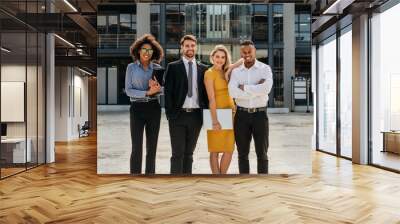 Diverse group of business professionals standing outdoors Wall mural