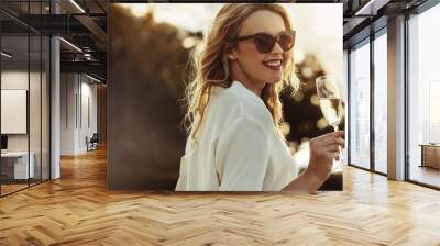 Elegant woman with a glass of wine Wall mural