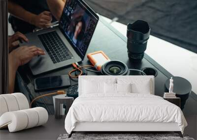 Equipments of a photographer on a table Wall mural