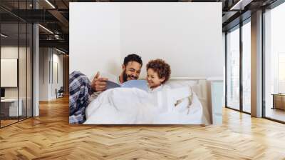 Father and son spending time together at home Wall mural