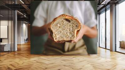 Female baker with fresh bread Wall mural