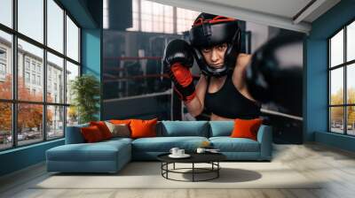 Female boxer in action inside the boxing ring Wall mural