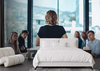 Female business leader conducting a meeting Wall mural