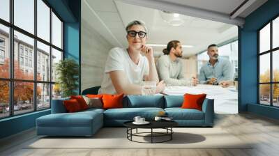 Female design professional attending a meeting with her team Wall mural