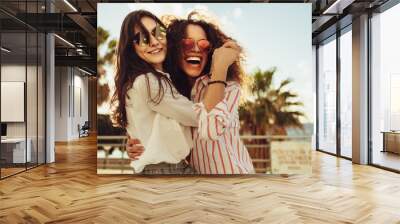 Female friends having fun on day out Wall mural