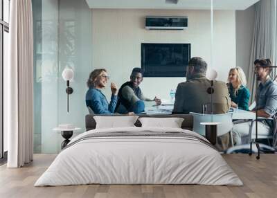 Female manager leads brainstorming meeting in office Wall mural