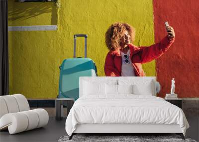 female traveller taking a selfie outdoors Wall mural