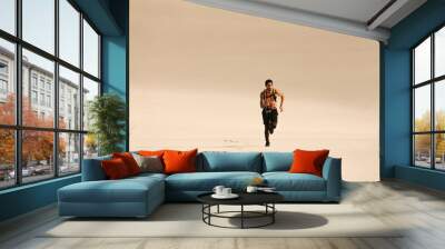 Fitness man running n desert Wall mural